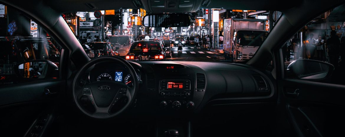 black car steering wheel during night time