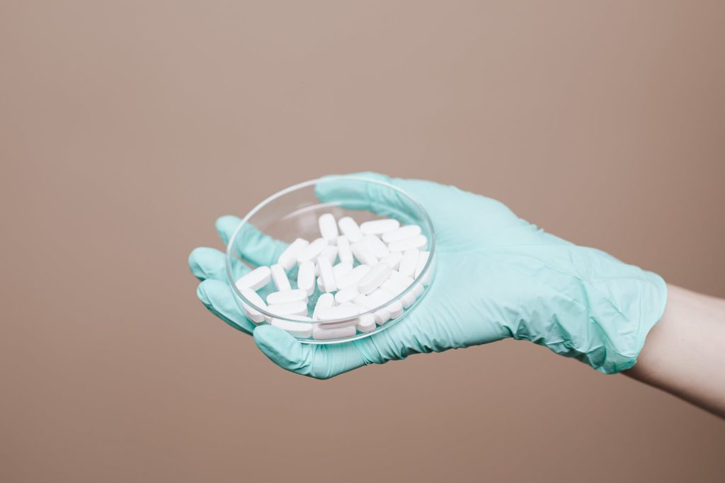 white tablets on petri dish