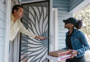 delivery driver delivering pizza to customer
