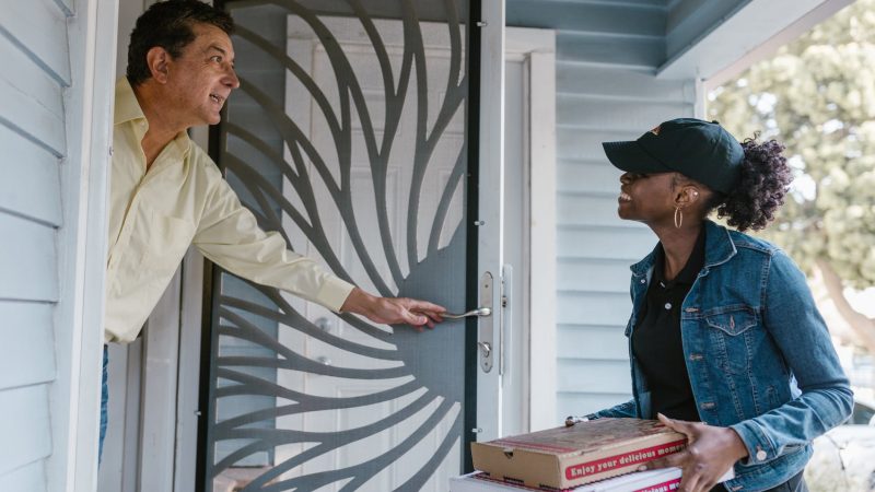 pizza delivery driver delivering pizza